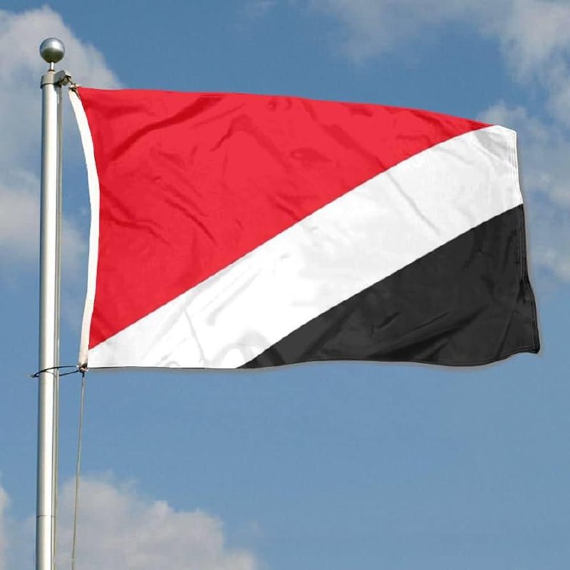 The flag of Sealand — red, white, and black, under the motto E Mare Libertas